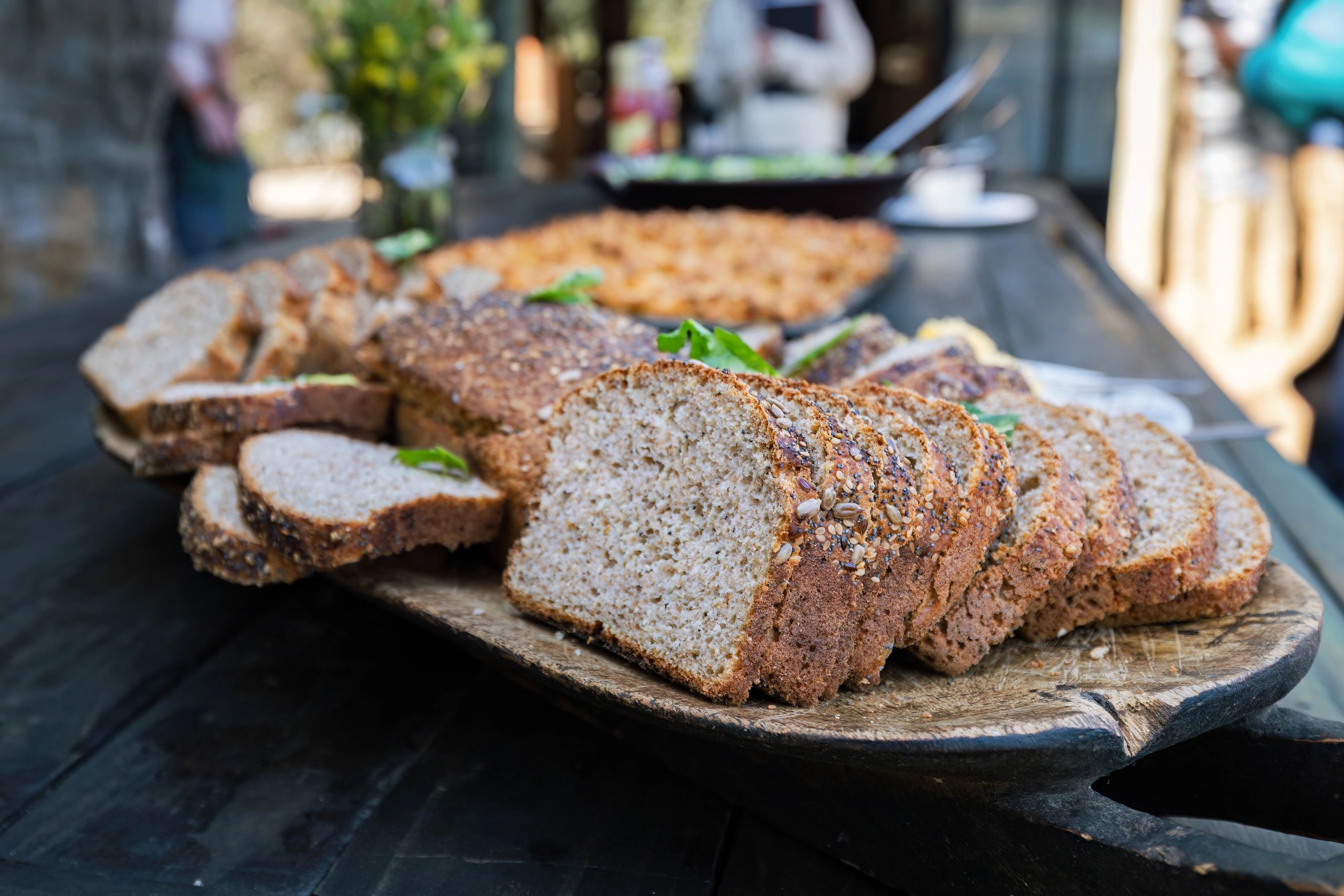 Sliced bread arranged on a wooden board